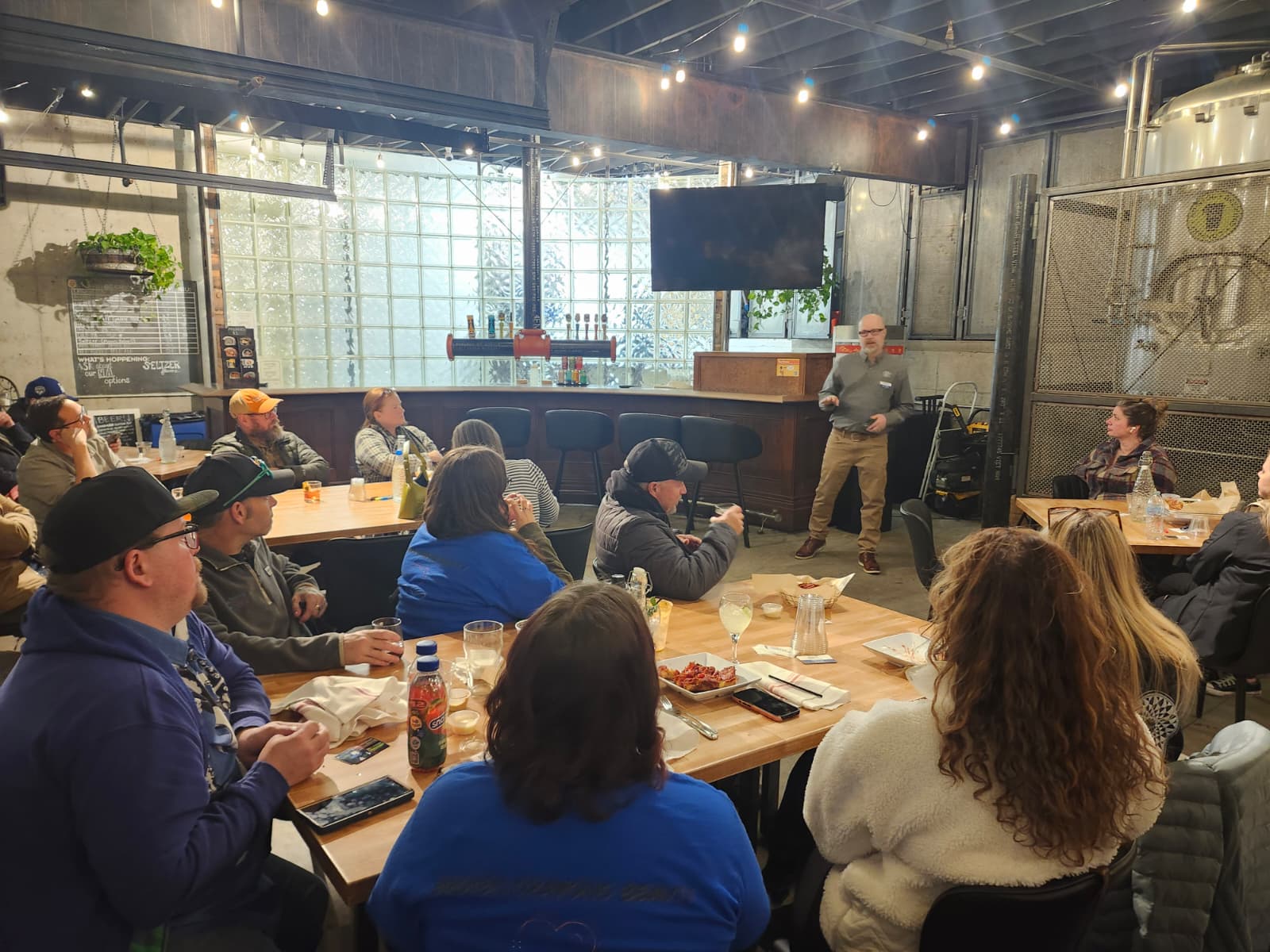 Nonprofit presenting to members at Bristol Brewing